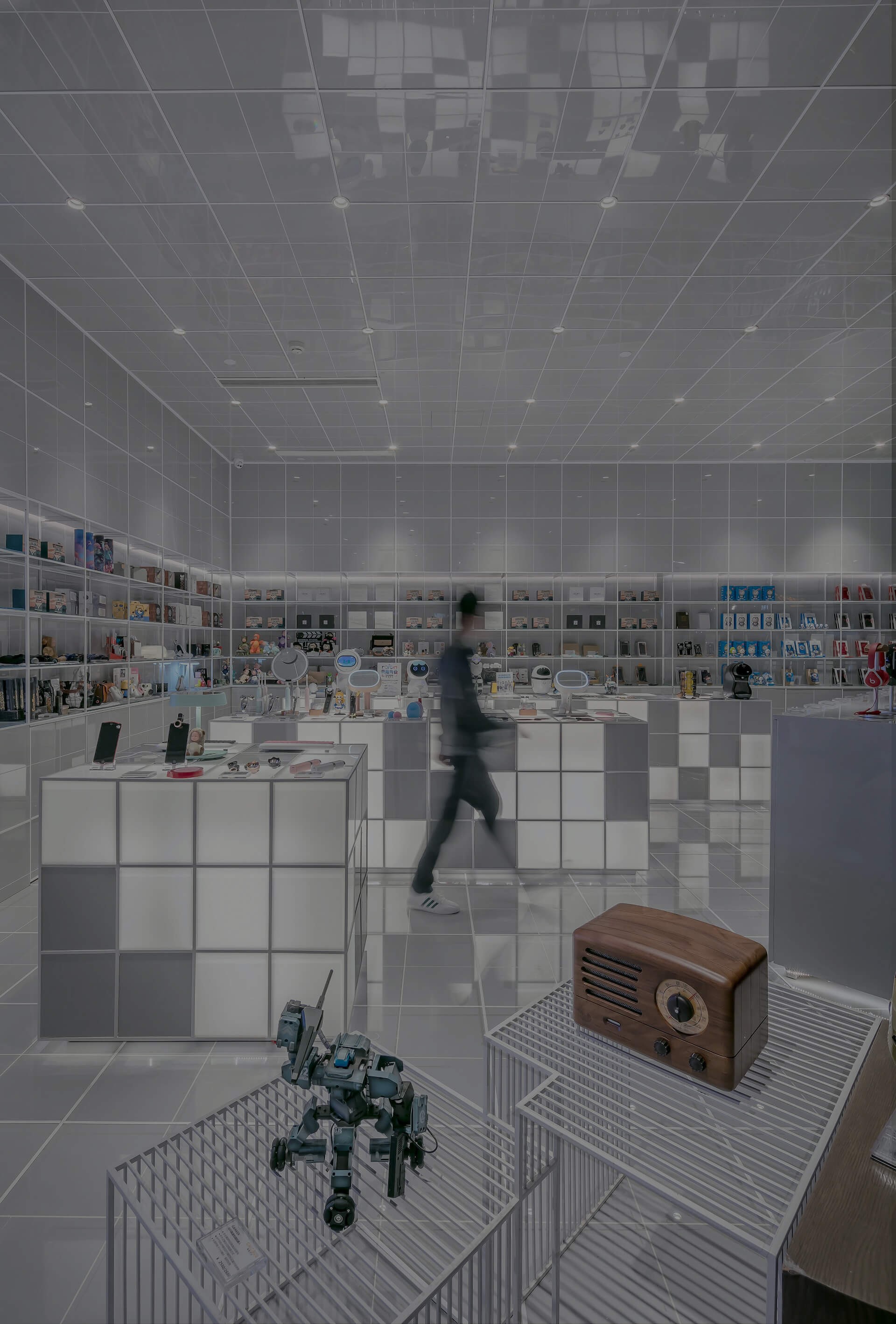 Background image for Mercado Libre case study hero section, Electronics store with a shopper passing in front of the camera, blurred